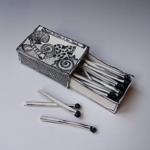 B: 'Matches for Fires on the Beach', 14x5,5x3cm